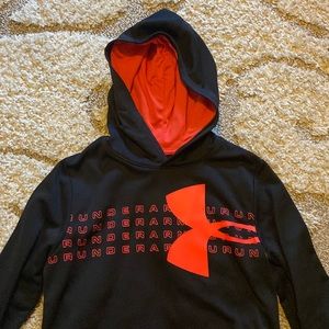 Black/bright orange Under Armour hoodie w center front pocket. 100% polyester.